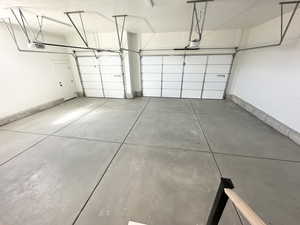Garage featuring a garage door opener