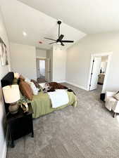 Carpeted bedroom featuring ceiling fan, a textured ceiling, and lofted ceiling