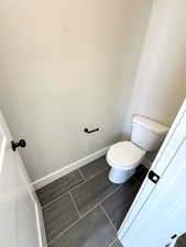 Bathroom with tile patterned flooring and toilet