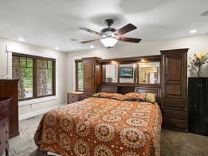 Master bedroom featuring ceiling fan and great views