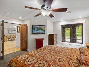 Master bedroom with ceiling fan, french doors, and great views