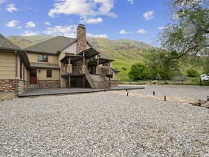 View of front of property featuring a deck with mountain view