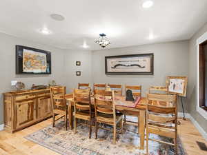 Dining space with light hardwood floors