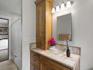 Bathroom with tile flooring and large vanity