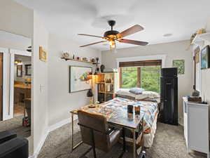 Bedroom with carpet and ceiling fan