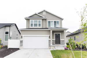 View of front of property with a garage