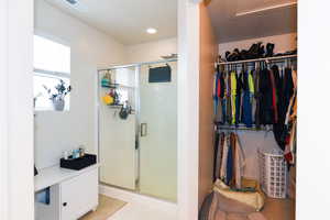 Bathroom with a shower with door