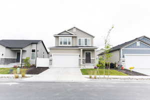 View of front of home featuring a garage