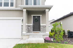 Entrance to property featuring a garage