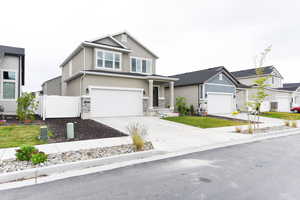 View of front facade featuring a garage