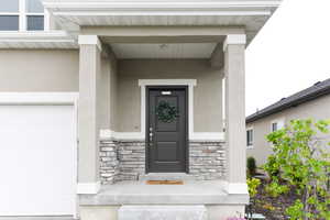 Property entrance featuring a garage