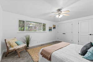 Bedroom featuring ceiling fan and carpet floors