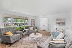 Living room with light hardwood / wood-style flooring