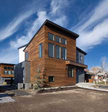 View of front of home with central AC unit