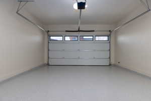 Garage featuring a garage door opener