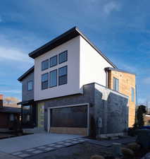 View of property featuring a garage