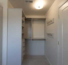 Spacious closet featuring carpet