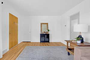 Living room featuring light hardwood flooring