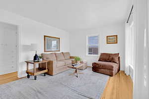 Living room with light hardwood flooring