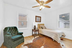 Bedroom 1 featuring hardwood floors throughout.