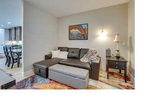 Living room with hardwood / wood-style flooring