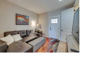 Living room with light hardwood / wood-style floors