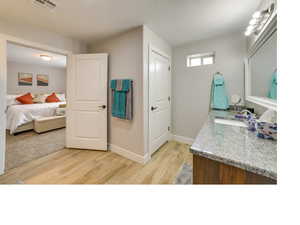 Bathroom featuring vanity and hardwood / wood-style flooring