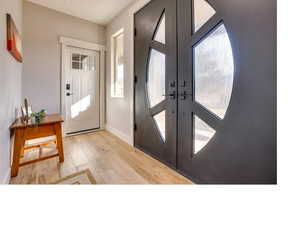 Foyer entrance featuring light hardwood / wood-style flooring