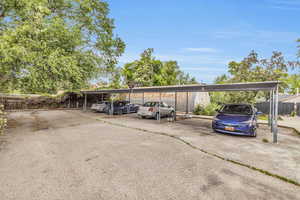 View of vehicle parking with a carport