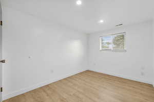 Unfurnished room with light hardwood / wood-style floors