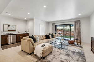 Living room featuring light hardwood / wood-style floors and bar