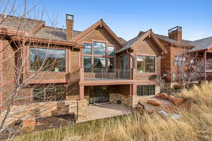 Rear view of property featuring a patio