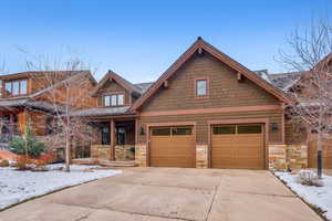 View of front facade featuring a garage