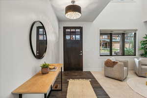 Foyer entrance featuring dark hardwood / wood-style floors