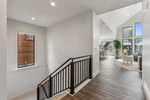 Staircase featuring wood-type flooring