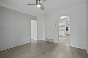 Unfurnished room featuring light hardwood / wood-style flooring and ceiling fan