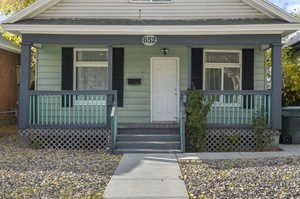 Property entrance featuring covered porch