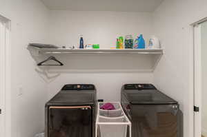 Washroom with washing machine and clothes dryer