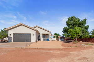 View of side of property with a garage