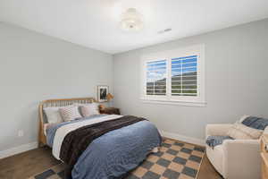 Bedroom featuring dark carpet