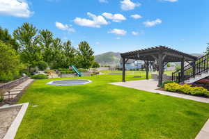 View of yard with a pergola