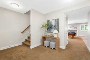 Stairway featuring carpet flooring and pool table