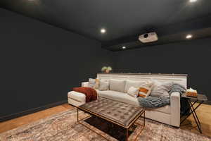 Home theater room with carpet flooring