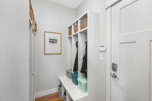 Mudroom with hardwood / wood-style flooring