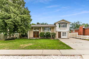 View of front of property with a front lawn