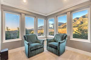 Sunroom with a mountain view and a wealth of natural light