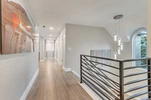 Hallway with light hardwood / wood-style floors