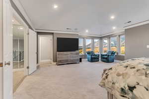 Bedroom featuring crown molding and light colored carpet