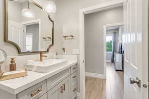 Bathroom with wood-type flooring and vanity