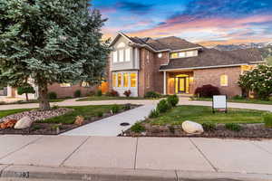 View of front of property featuring a yard